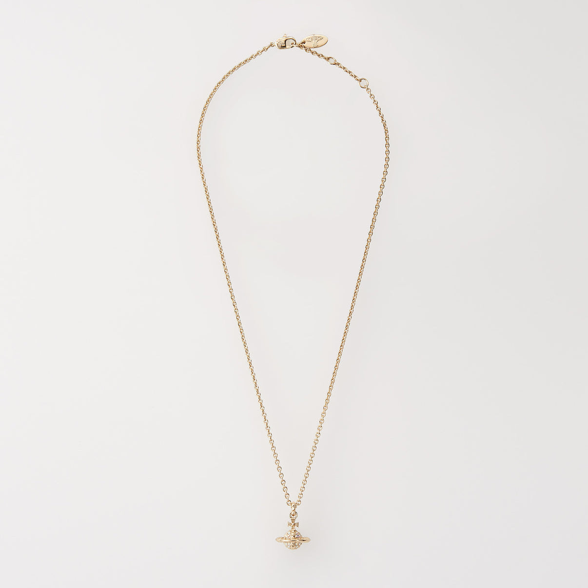 Vivienne Westwood Gold necklace with a small pendant on a light gray background