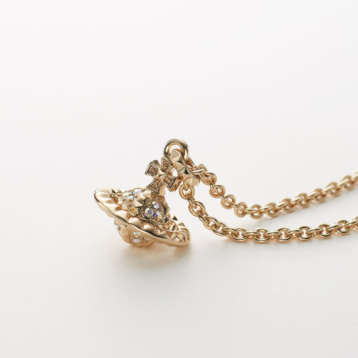 Vivienne Westwood Gold necklace with a pendant on a white background