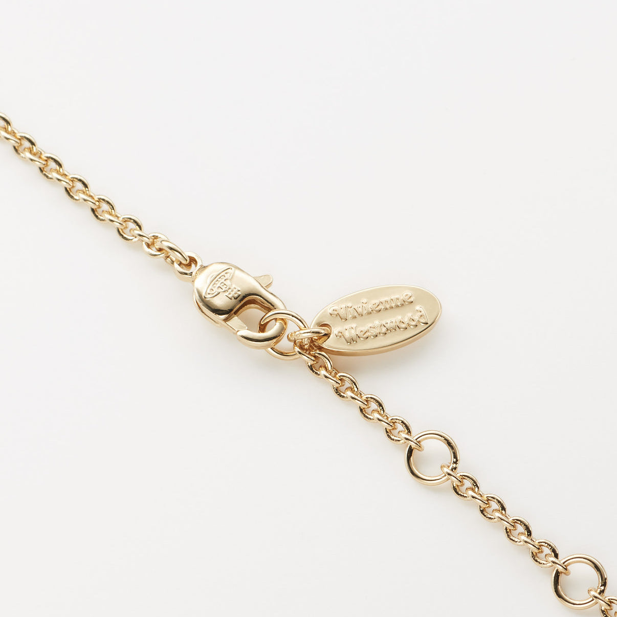 Vivienne Westwood Gold chain bracelet with a clasp on a white background