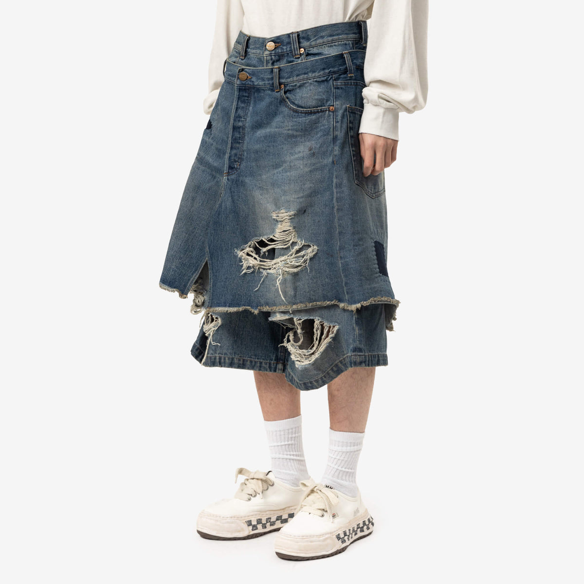Short en jean superposé réparé