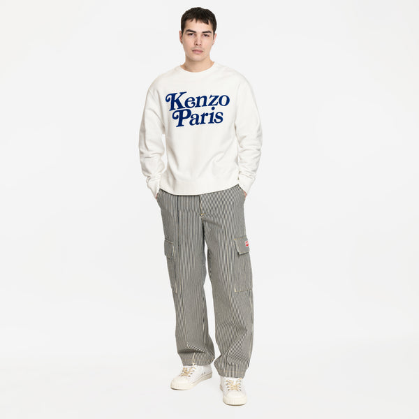 Image 5 of Margiela New Evolution Mid White Sneakers on model styled with Kenzo x Verdy sweatshirt and Kenzo striped cargo pants