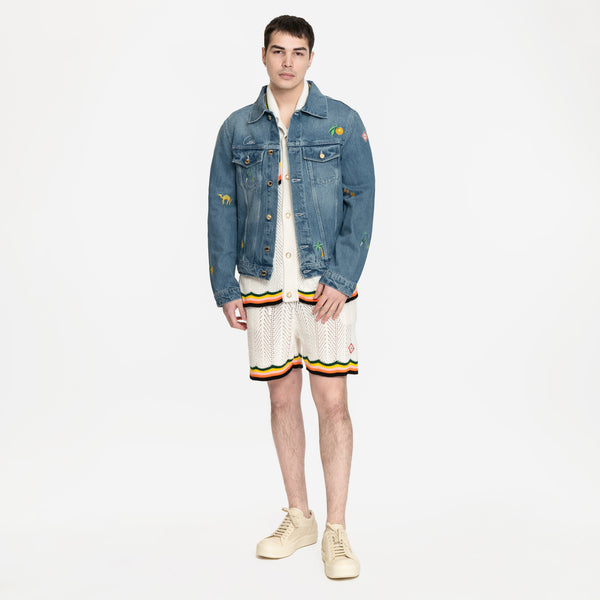 Image 4 of Casablanca Stone Wash Motif Denim Jacket with Casablanca knit shirt and shorts and Rick Owens vintage sneakers in white
