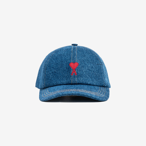 front view of cap in denim, with embroidered heart logo