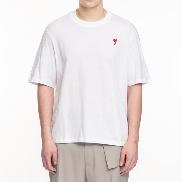 white tshirt with red embroidered AMI heart logo