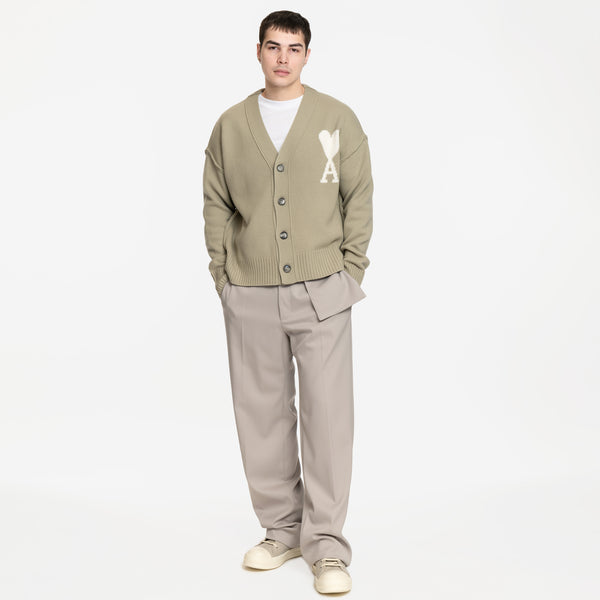 model wearing sage cardigan with MM6 grey trousers and rick owens high top sneaks in pearl