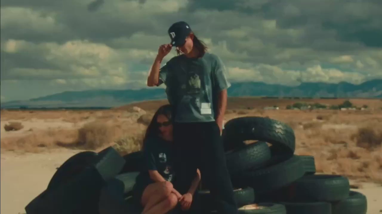 Paly Hollywood promotional video of female model holding onto male models leg.