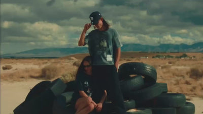 Paly Hollywood promotional video of female model holding onto male models leg.